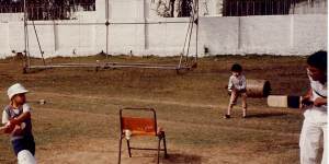 Usman Khawaja (left) as a small child playing in Pakistan,with a thigh pad covering a leg.