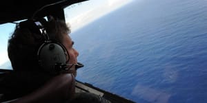 Royal New Zealand Airforce P-3K2-Orion aircraft co-pilot and Squadron Leader Brett McKenzie during the initial search for missing Malaysia Airlines flight MH370 in April.