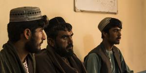 Left to right:Shamsullah,Fazal Rahman and Sharifullah,whose families were alleged victims of separate incidents involving Australian soldiers,are interviewed by Dad Mohammad Hamidzai (out of frame) inside the Uruzgan office of the Afghan Independent Human Rights Commission (AIHRC) in Tarin Kowt.
