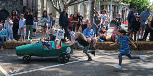 Children take part in a billycart race in North Melbourne in October. 