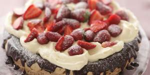 Hazelnut gateaux with chocolate ganache,whipped cream and strawberries.