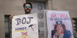 Nicholas Rivers of Maine protests outside the Department of Justice in Washington. 