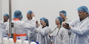 Officials and members of Chinese state owned media companies visit the A2 Milk factory in Sydney. 