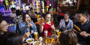 Friends gather at Burwood Chinatown to experience novel dishes such as dango mochi sticks and hotteok,a filled pancake.