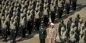 Revolutionary Guard’s ground force troops stand while attending a manoeuvre in north-western Iran last year.