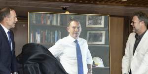 Former prime minister Tony Abbott unveils his portrait with artist Johannes Leak.