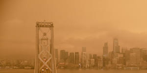 Smoke from the California wildfires hangs over San Francisco bridge.