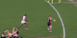 Jack Higgins boots a memorable fourth quarter goal from right on the boundary.