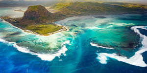 The amazing"underwater waterfall"effect can be seen from the air looking back towards Le Morne.