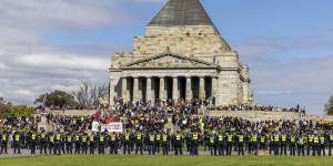 Police respond to protests by construction workers at the Shrine of Remembrance today.