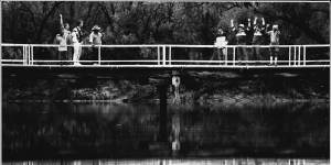 On the standing bridge in Mungindi are supporters for the opposing State of Origin teams - NSW to the left,Queensland to the right. May 15,1993.