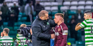 Celtic manager Ange Postecoglou speaks with fellow Australian,Hearts midfielder Cameron Devlin,after beating them 1-0 in December 2021.