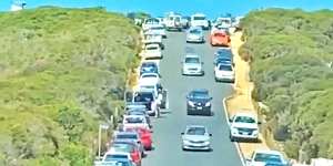 Cars line the street in Point Addis on the Great Ocean road on Saturday.