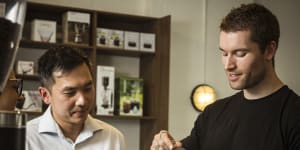 Head barista Matt Coulson talks customer Tin through making his own coffee at Rosso Coffee Experience.