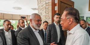 A photo of Hamas leader Ismail Haniyeh (left) and Anwar posted on Facebook by the Malaysian leader last week after a phone conversation between the pair.