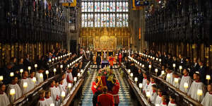 The Queen’s coffin is carried by pall bearers in St George’s Chapel,Windsor Castle.