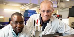 PhD researcher Olawale Oloye (left) and Professor Anthony O’Mullane have developed a method to capture carbon for use in cement.