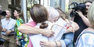 Women hug outside court after the findings in the pelvic mesh judgment were delivered in November 2019.
