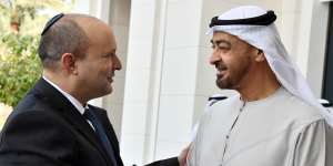 Israeli Prime Minister Naftali Bennett,left,shakes hands with Sheikh Mohammed bin Zayed Al Nahyan,the crown prince of Abu Dhabi and de facto ruler of the United Arab Emirates,in Abu Dhabi,on December 13. The countries have recently reestablished relations.