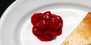 Cheesecake with poached raspberries. 