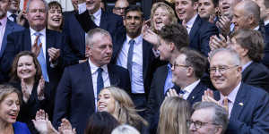 Incoming Prime Minister Rishi Sunak is greeted by colleagues at Conservative Party headquarters.