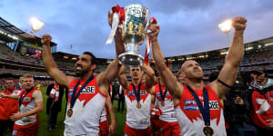 Adam Goodes and Jarrad McVeigh celebrate the Swans’ 2012 premiership victory.
