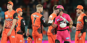 Sydney Sixers star Dan Christian shakes hands with Dan Christian of the Scorchers,who are wearing their Indigneous strip.