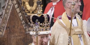 King Charles III holds the Sovereign’s Sceptre with Cross after he was crowned with St Edward’s Crown during the coronation ceremony at Westminster Abbey in London on Saturday.