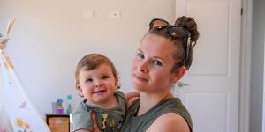 Hannah Fuller with her son Alfie in their refurbished home. 