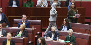 Senator Fatima Payman crosses the floor last week during a division on a motion to recognise a state of Palestine.