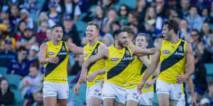 On the up:Tigers celebrate a big win over Freo at Domain Stadium in Perth.