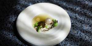 “Oyster and pearls”:A Tasmanian oyster with apple horseradish coulis,a pearl made of horseradish mousse,apple slice,and 1g of Ossetra caviar. 