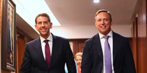Queensland Premier Steven Miles (right) and deputy Cameron Dick (left) arrive to speak to the media