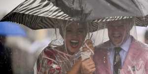 An umbrella,sensible shoes and a sense of humour is required on a soggy race day.
