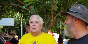 Clive Palmer (centre) attended the Brisbane rally on Saturday.