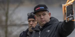 Controversial Danish far-right MP Rasmus Paludan,also a Swedish citizen,burns the Koran outside the Turkish embassy in Stockholm last weekend.