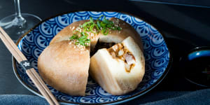 The giant pork bun,stuffed with a chunky mix of belly pork,chestnuts and mustard greens.
