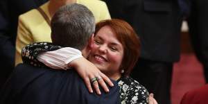 Senator Kimberley Kitching is embraced by Bill Shorten after her first speech in the Senate in 2016.