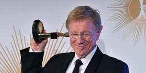 Kerry O'Brien poses with his Logie after being inducted into the Hall of Fame.