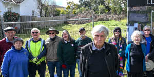 Ian Hundley (centre) and other residents outside a property where a tree was illegally removed in Balwyn North.