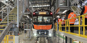 A new intercity fleet train sits idle in a Central Coast maintenance facility amid a prolonged stand-off between rail unions and the NSW government.