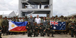 Australian Defence Minister Richard Marles (centre) with Philippine National Defence Secretary Gilberto Teodoro jnr (centre left),Australian ambassador to the Philippines Hae Kyong Yu (centre right),and soldiers before the drills.