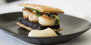 The seared scallops with boudin noir pastry.