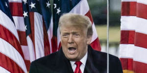 President Donald Trump addresses a rally protesting at the presidential election results on the Ellipse,with the White House in the background,in Washington on Wednesday.