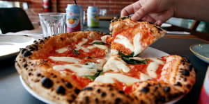 Puffy-crusted margherita pizza.