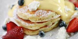 Sweet start:Fluffy hotcakes with passionfruit curd and fruit.