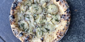 Pizza Madre’s garlic puree,potato,manchego and fried rosemary pizza.