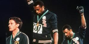 October 16,1968:Tommie Smith and John Carlos protest against racism in the United States. On the dais with them is Australian silver medallist Peter Norman,who was sidelined for his role in the protest.
