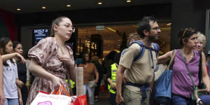 ’Tis the season to be gloomy:Shoppers on Melbourne’s Bourke Street Mall.