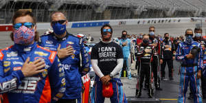 Bubba Wallace wears an"I Can't Breath - Black Lives Matter"T-shirt under his fire suit on June 7,in solidarity with protesters around the world after the death of George Floyd.